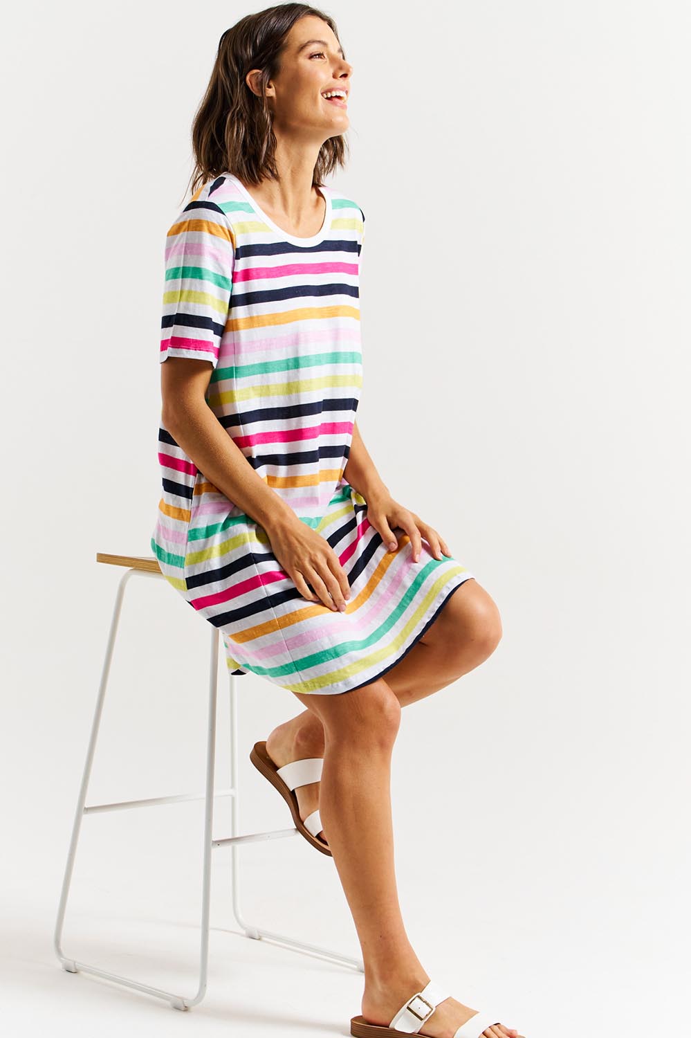 A model wearing the Nyree Cotton Dress in colour Rainbowstr, from the front, showing the whole outfit