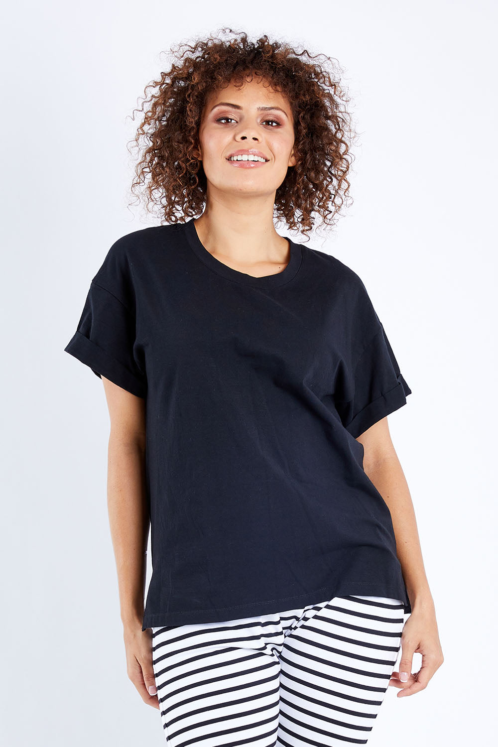 Model Lala wearing size 10 of the Boxy Tee in colour Black (Black), from the front, cropped image
