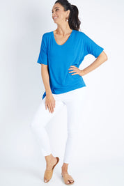Model Gemma wearing size 10 of the Lisbon Tee in colour Cornflower (Blue), from the front, showing the whole outfit