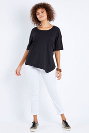 Model Lala wearing size 10 of the Florence Top in colour Black (Black), from the front, showing the whole outfit
