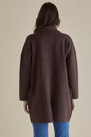 A model wearing the Bristol Coatigan in colour Brown, from the back