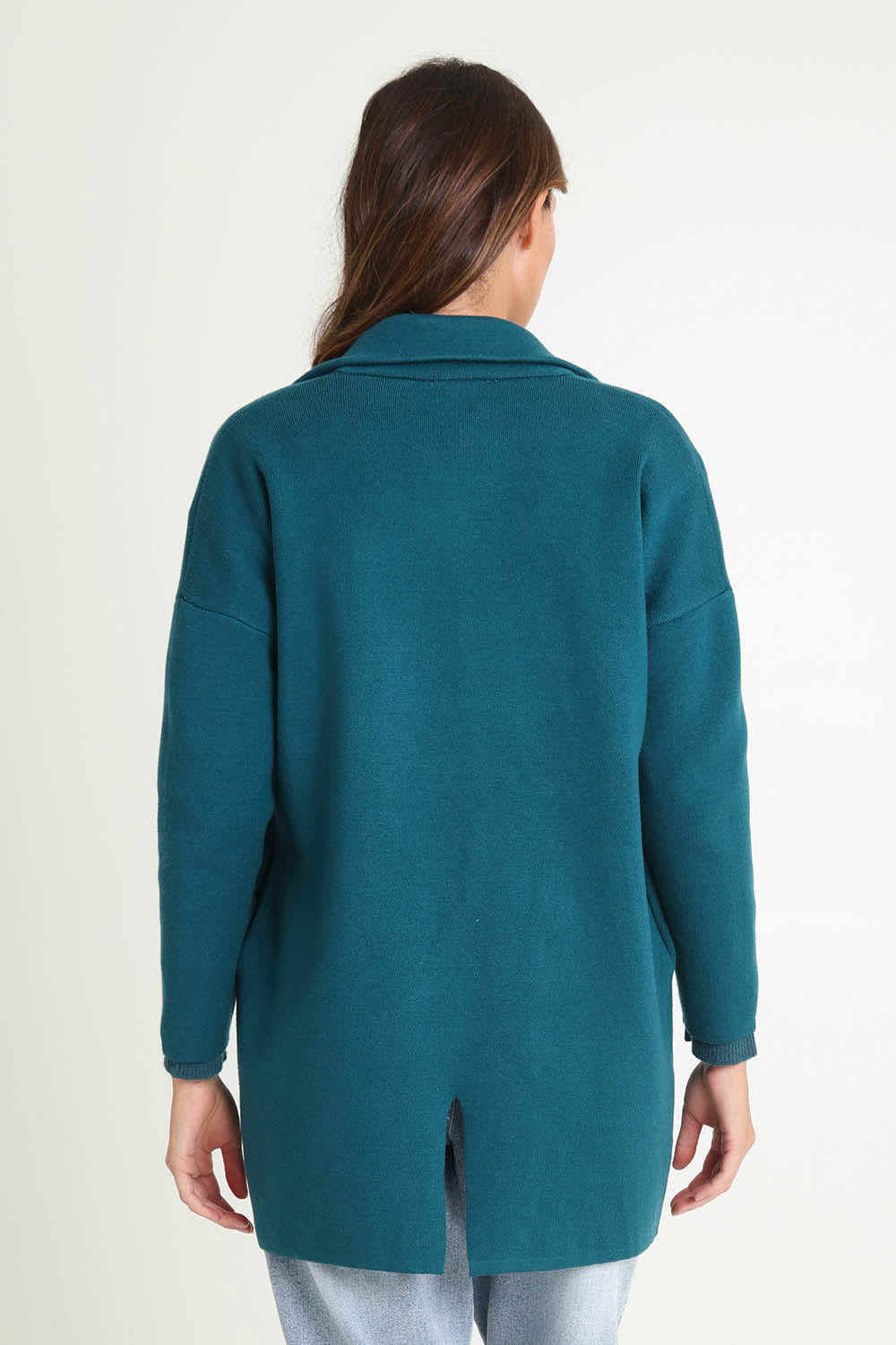 Model Madeline wearing size 10 of the Bristol Coatigan in colour Teal (Green), from the back