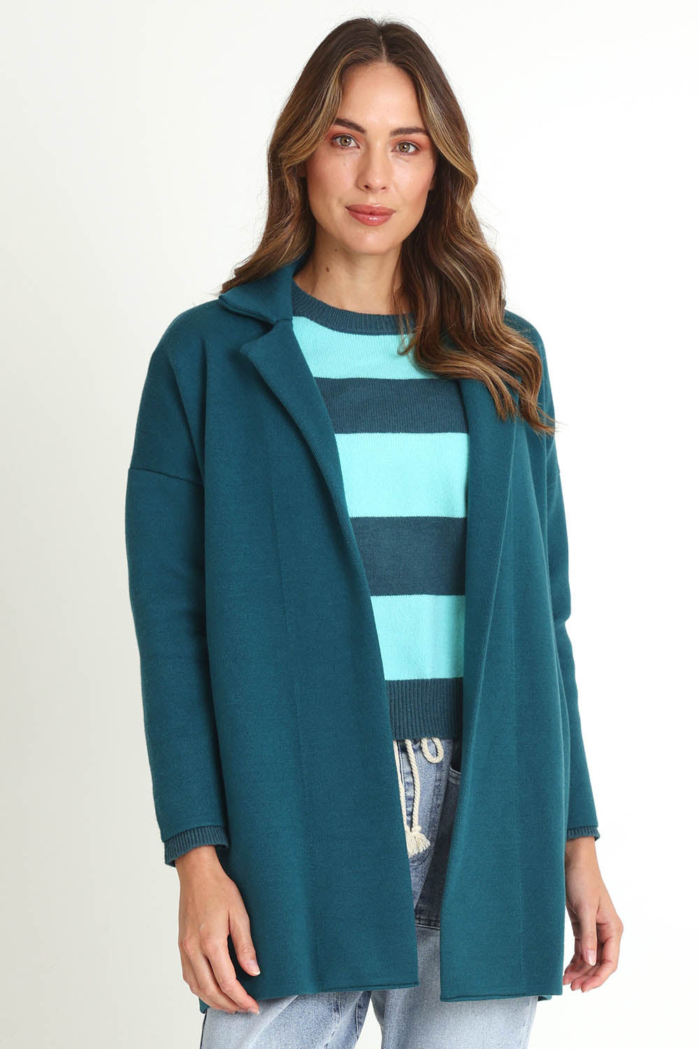 Model Madeline wearing size 10 of the Bristol Coatigan in colour Teal (Green), from the front, cropped image