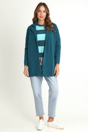 Model Madeline wearing size 10 of the Bristol Coatigan in colour Teal (Green), from the front, showing the whole outfit