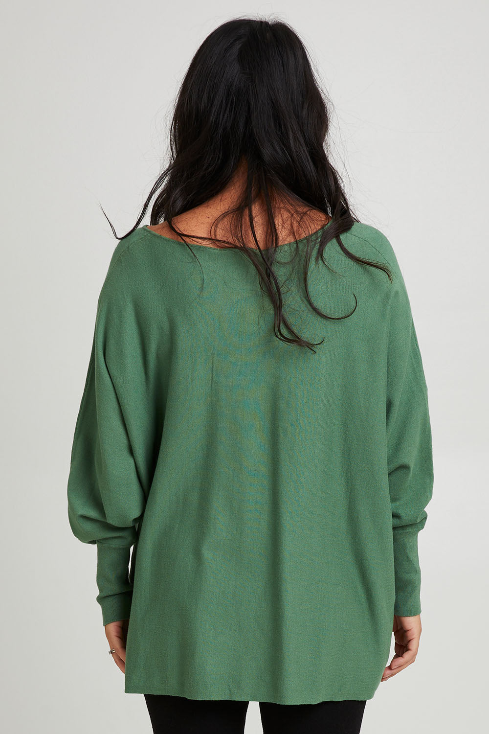 Model Katie wearing size 10 of the Destiny Knit Jumper in colour Powdergree (Green), from the back