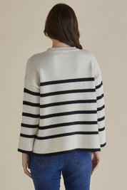 A model wearing the Edith Knit Jumper in colour Blkstripe (White), from the back