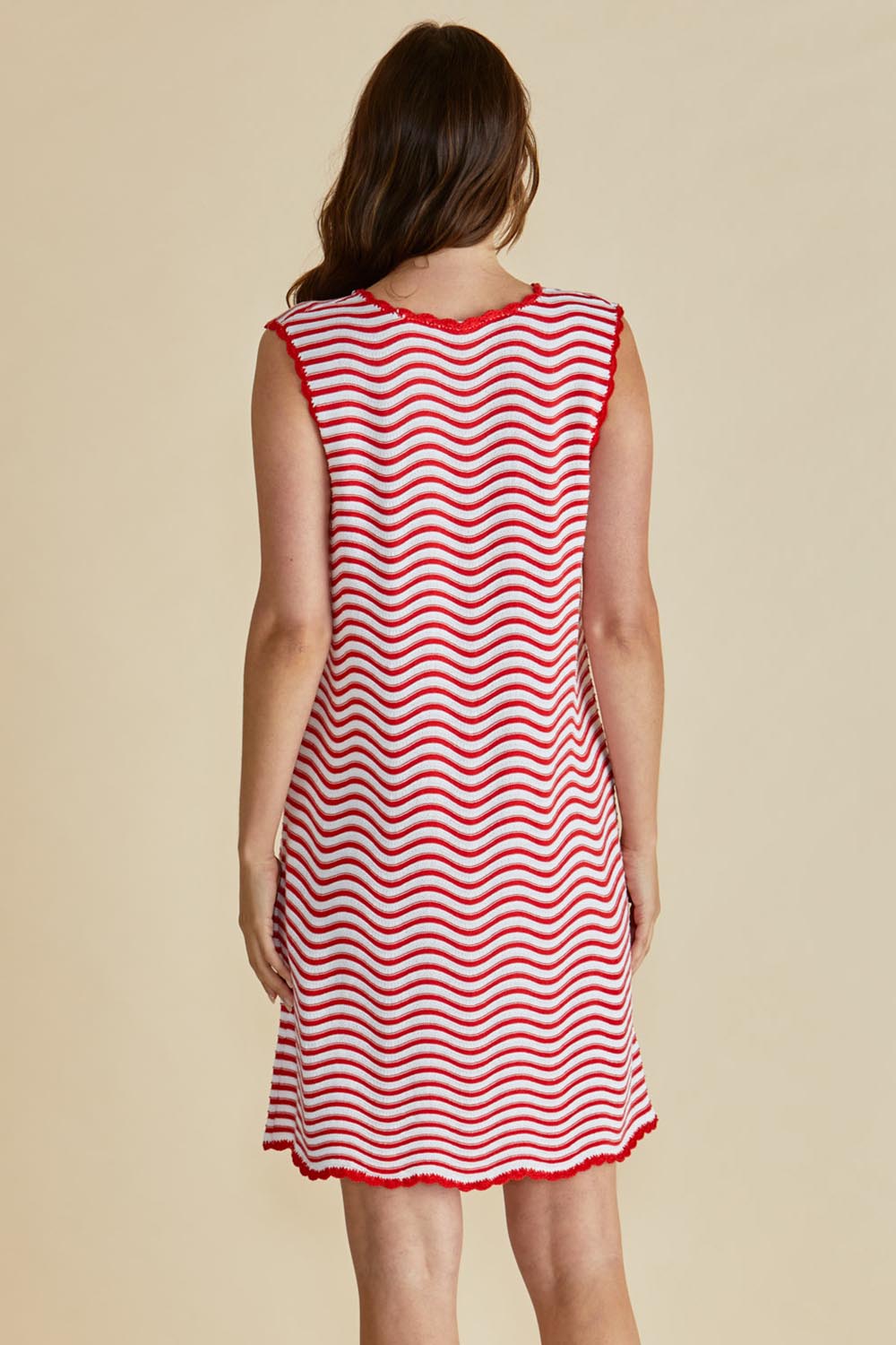 A model wearing the Viola Cotton Tank Dress in colour Redwhite (Red), from the back
