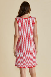 A model wearing the Viola Cotton Tank Dress in colour Redwhite (Red), from the back