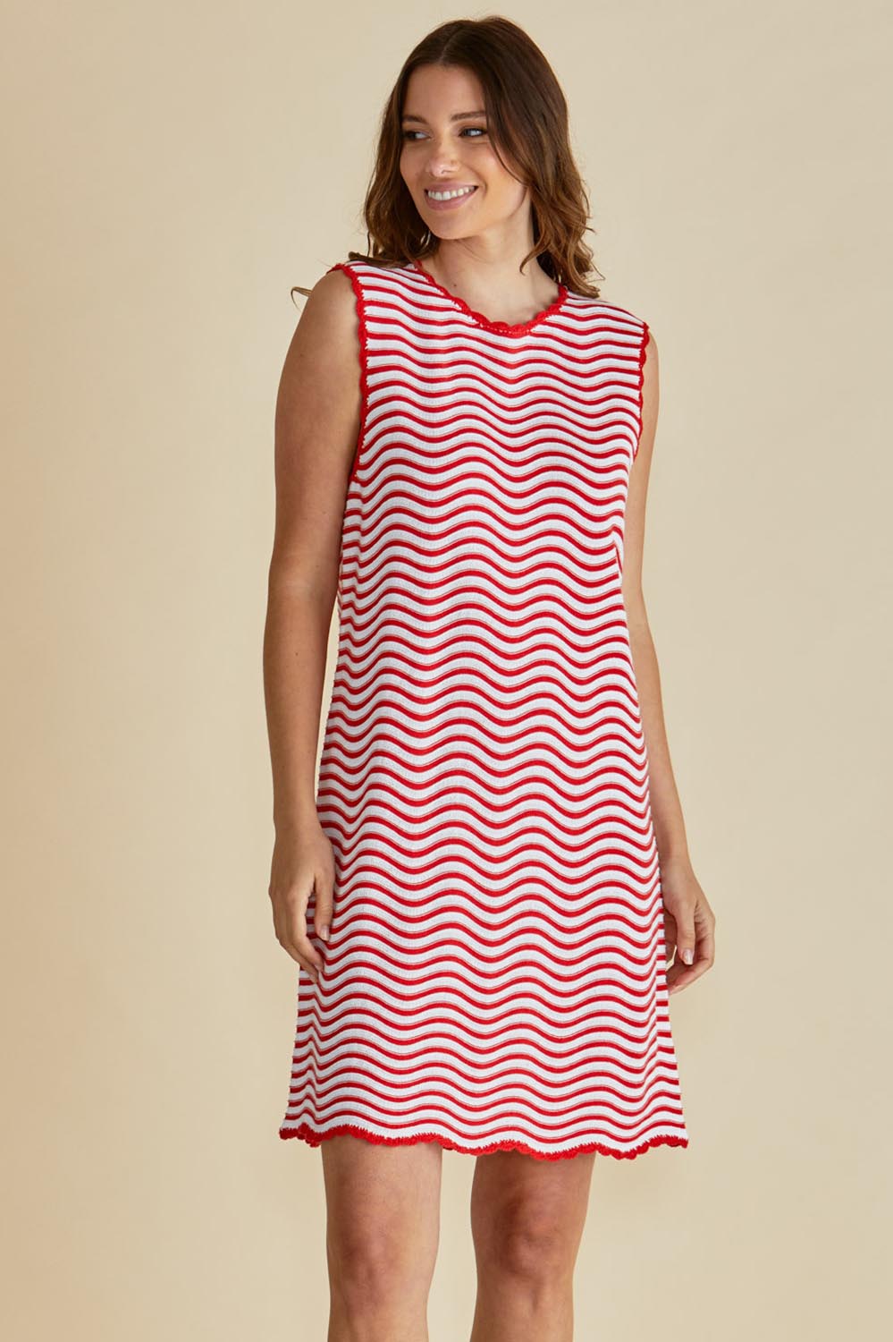 A model wearing the Viola Cotton Tank Dress in colour Redwhite (Red), from the front, cropped image