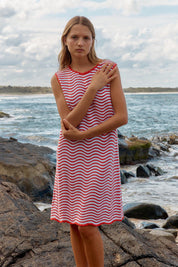A model wearing the Viola Cotton Tank Dress in colour Redwhite (Red), from the front, showing the whole outfit
