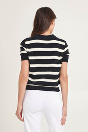 Model Madeline wearing size 10 of the Salford Cotton Knit Polo in colour Creamblk (Black), from the back