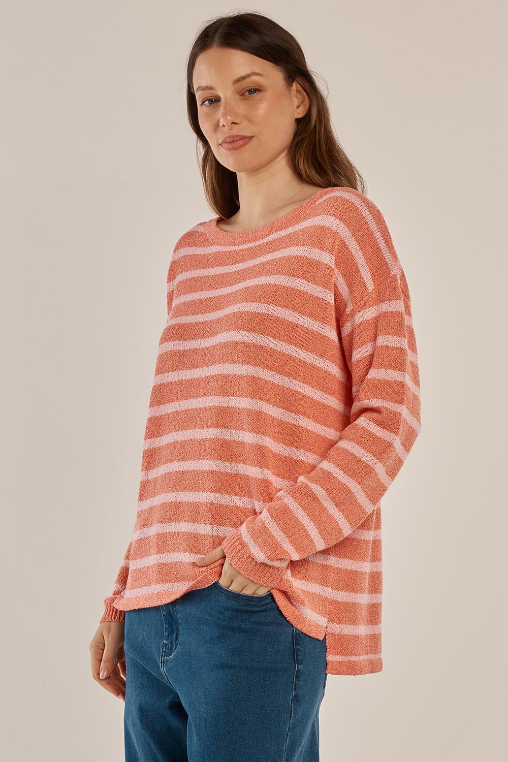 A model wearing the Bradford Knit Top in colour Coralpink (Pink), from the front, cropped image