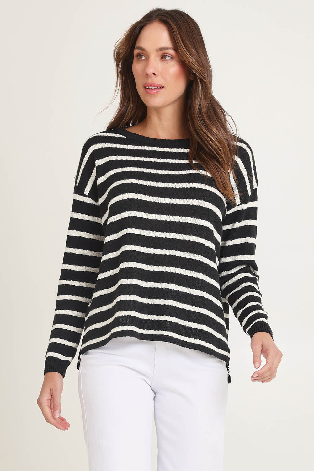 Model Madeline wearing size 10 of the Bradford Knit Top in colour Creamblk (Black), from the front, cropped image