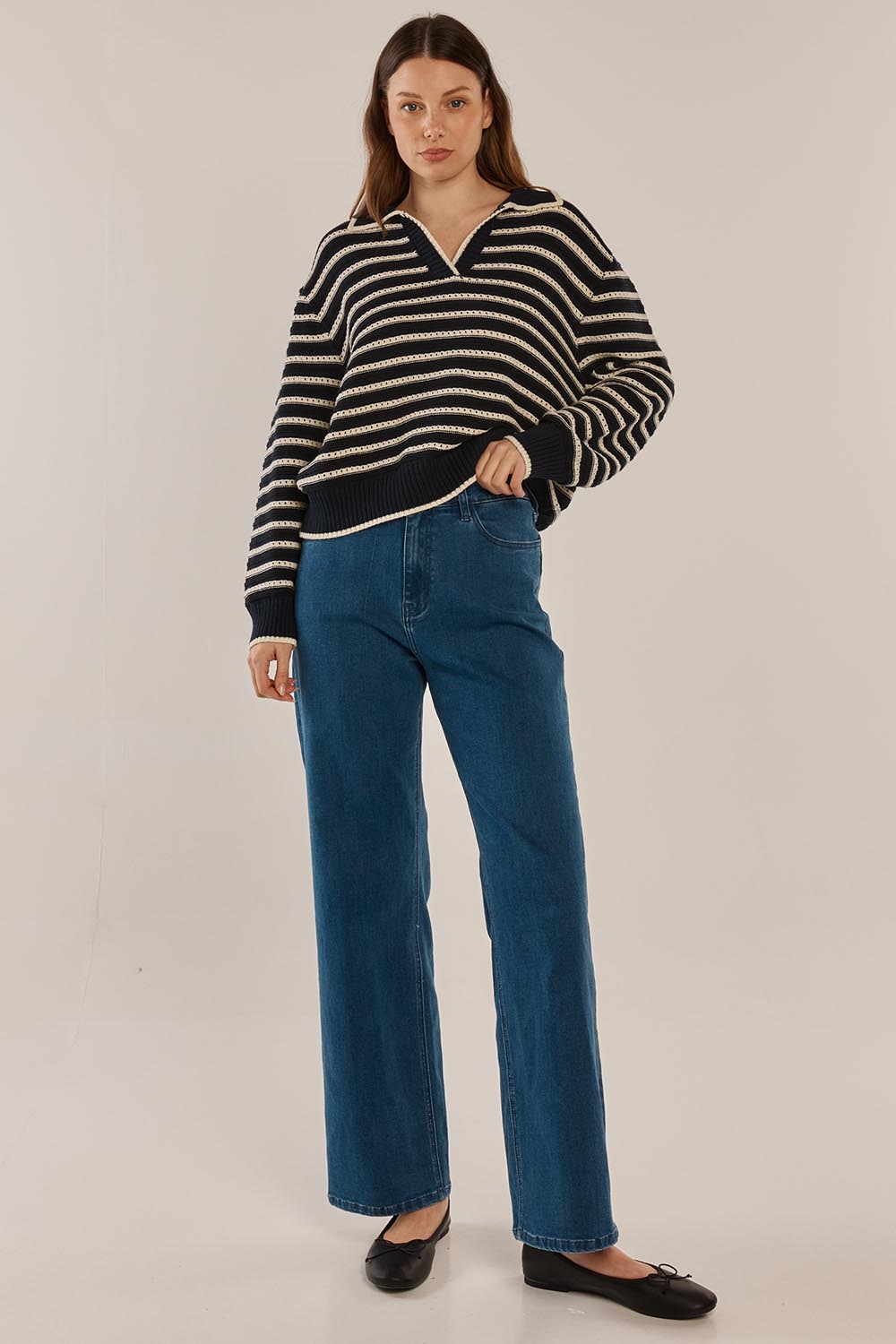 A model wearing the Aberdeen Polo Knit Sweat in colour Navystripe (Blue), from the front, showing the whole outfit