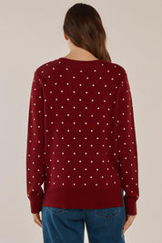 A model wearing the Louis Sweater in colour Burgandy (Red), from the back