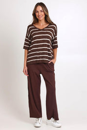 Model Madelinec wearing size 10 of the Aries V-Neck Sweater Tee – Chocolate in colour Chocolate, from the front