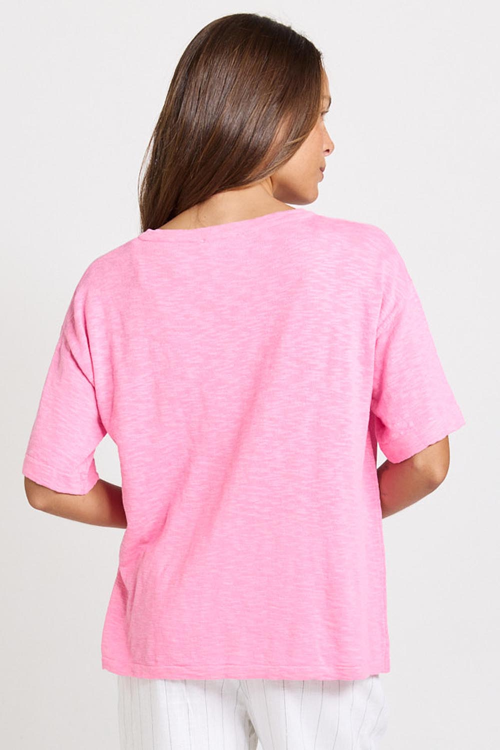 Model Genericm wearing size sample of the Aries V-Neck Sweater Tee – Pink in colour Pink, from the back