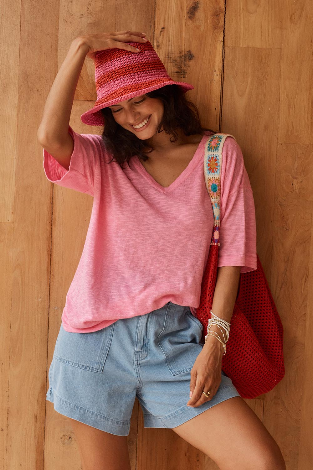 Model Genericm wearing size sample of the Aries V-Neck Sweater Tee – Pink in colour Pink, in a cropped view