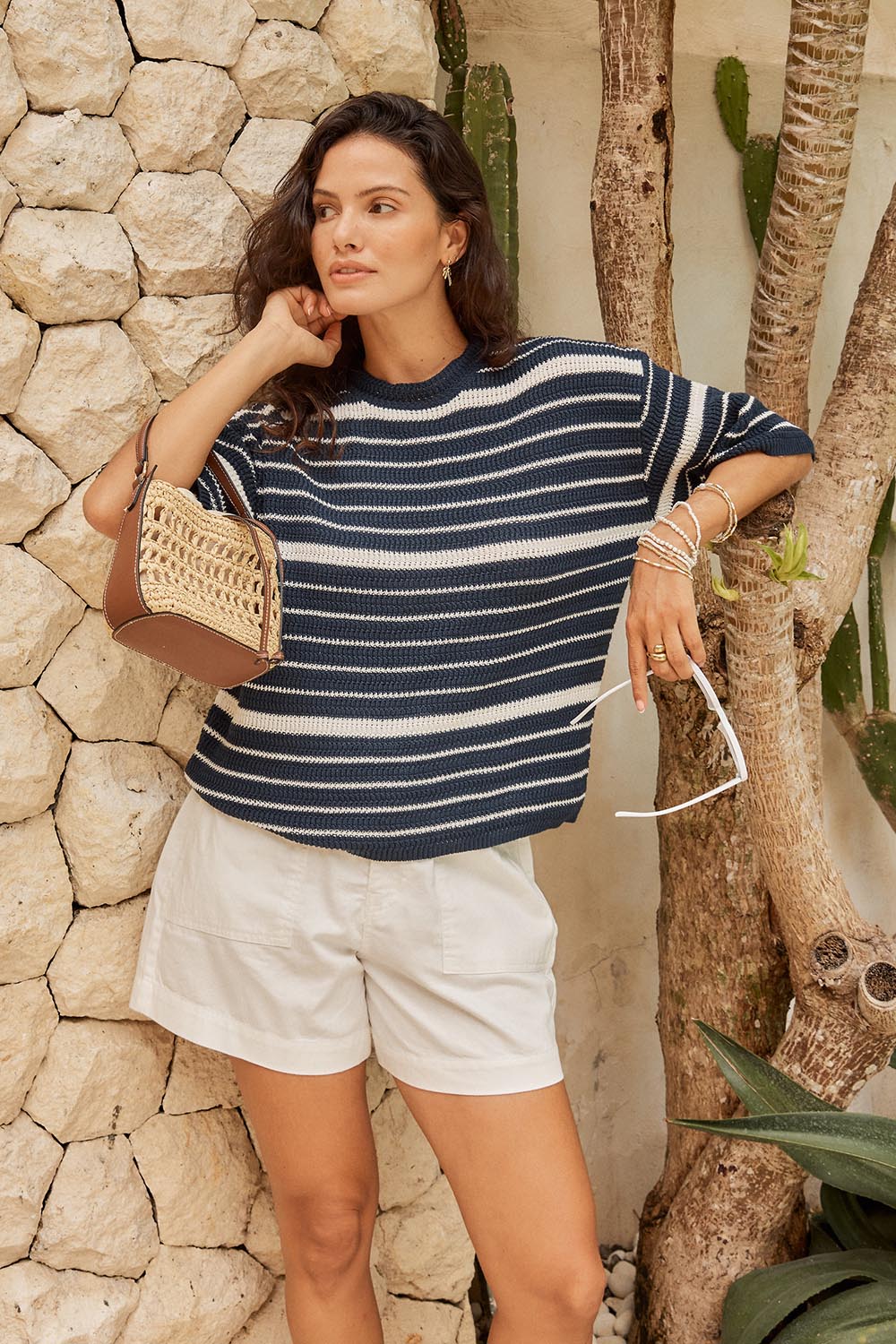 Model Genericm wearing size sample of the Dylan Knit Tee – Navywhite in colour Navywhite, from an angle