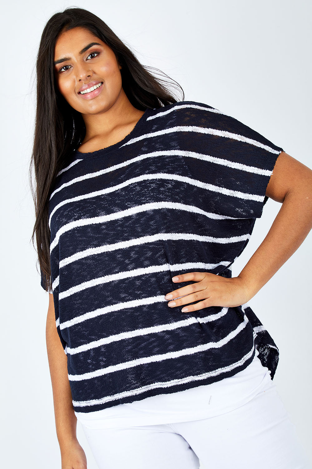 Model Shanaya wearing size L of the Grace Oversized Knit in colour InkWhite (Blue), from the front, cropped image