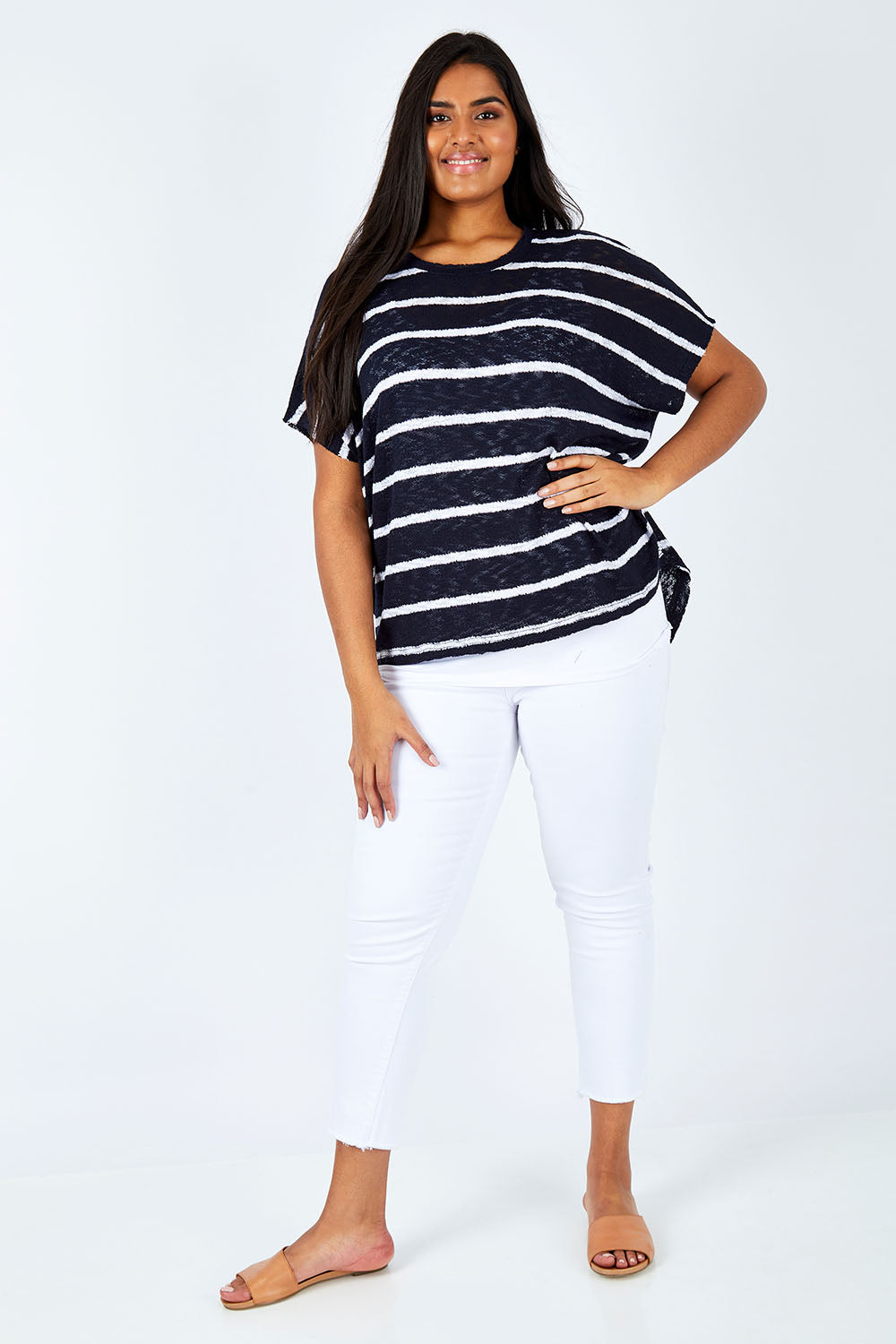 Model Shanaya wearing size L of the Grace Oversized Knit in colour InkWhite (Blue), from the front, showing the whole outfit