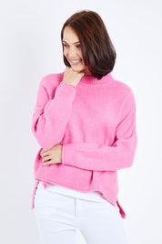 Model Andrea wearing size S of the Jemima Knit in colour Orchid (Pink), from the front, cropped image