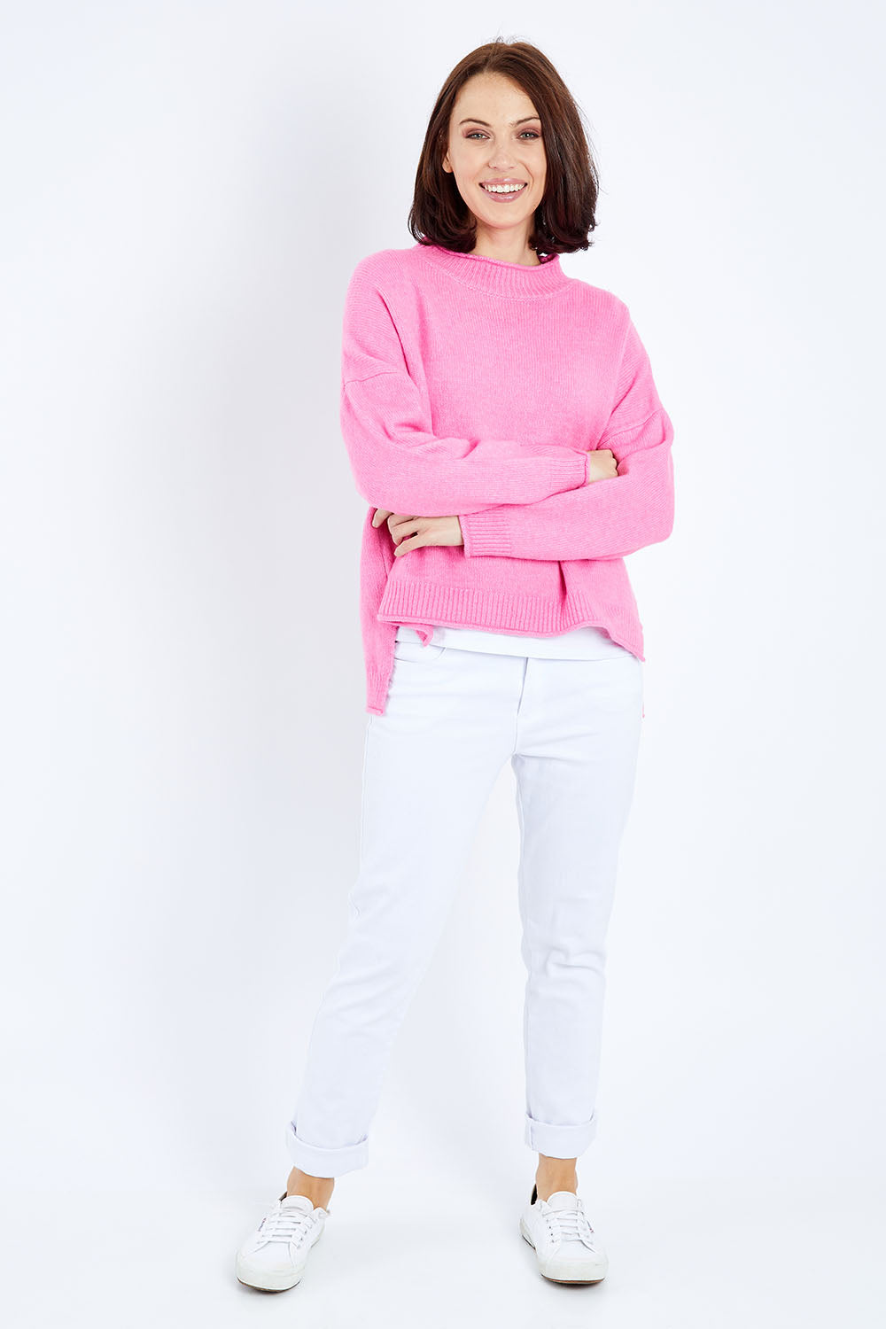 Model Andrea wearing size S of the Jemima Knit in colour Orchid (Pink), from the front, showing the whole outfit