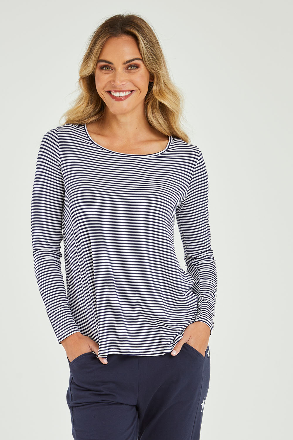 Model Alice wearing size 10 of the Evanna L/S Top in colour Navywhite (Blue), from the front, cropped image