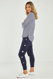 Model Alice wearing size 10 of the Evanna L/S Top in colour Navywhite (Blue), from the front, showing the whole outfit