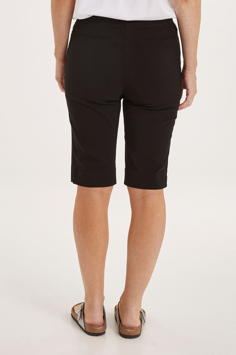 Model Sally wearing size 10 of the Bermuda Bengaline Short in colour Black (Black), from the back