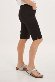Model Sally wearing size 10 of the Bermuda Bengaline Short in colour Black (Black), from the front, cropped image
