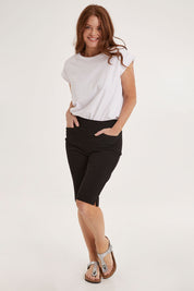 Model Sally wearing size 10 of the Bermuda Bengaline Short in colour Black (Black), from the front, showing the whole outfit