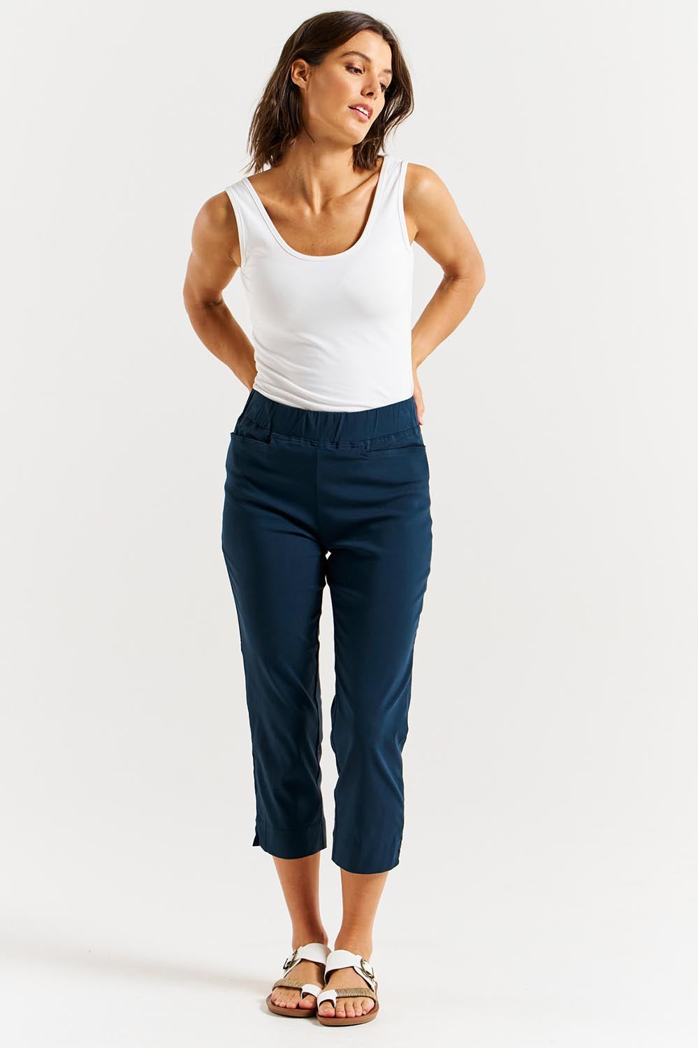 A model wearing the Crop Bengaline Pant in colour Navy (Blue), from the front, showing the whole outfit