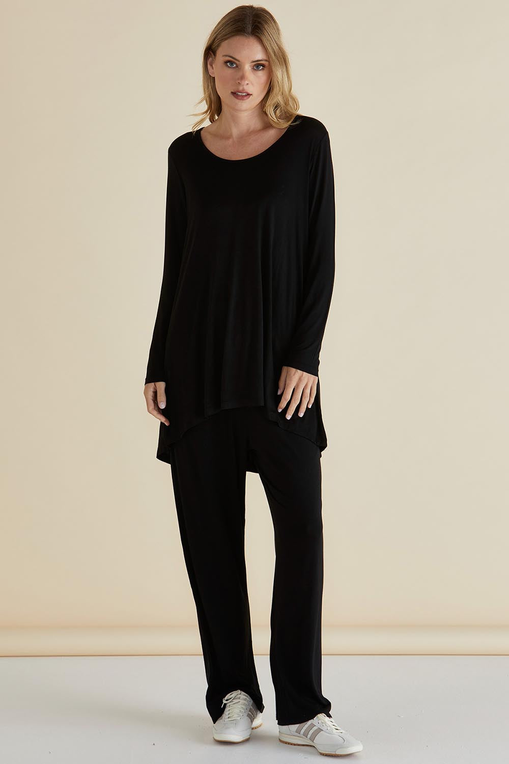 A model wearing the Cairo Tunic Bamboo Top in colour Black (Black), from the front, showing the whole outfit