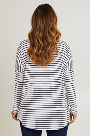 Model Laura wearing size 14 of the Cowl Bamboo Top in colour Monostripe (White), from the back