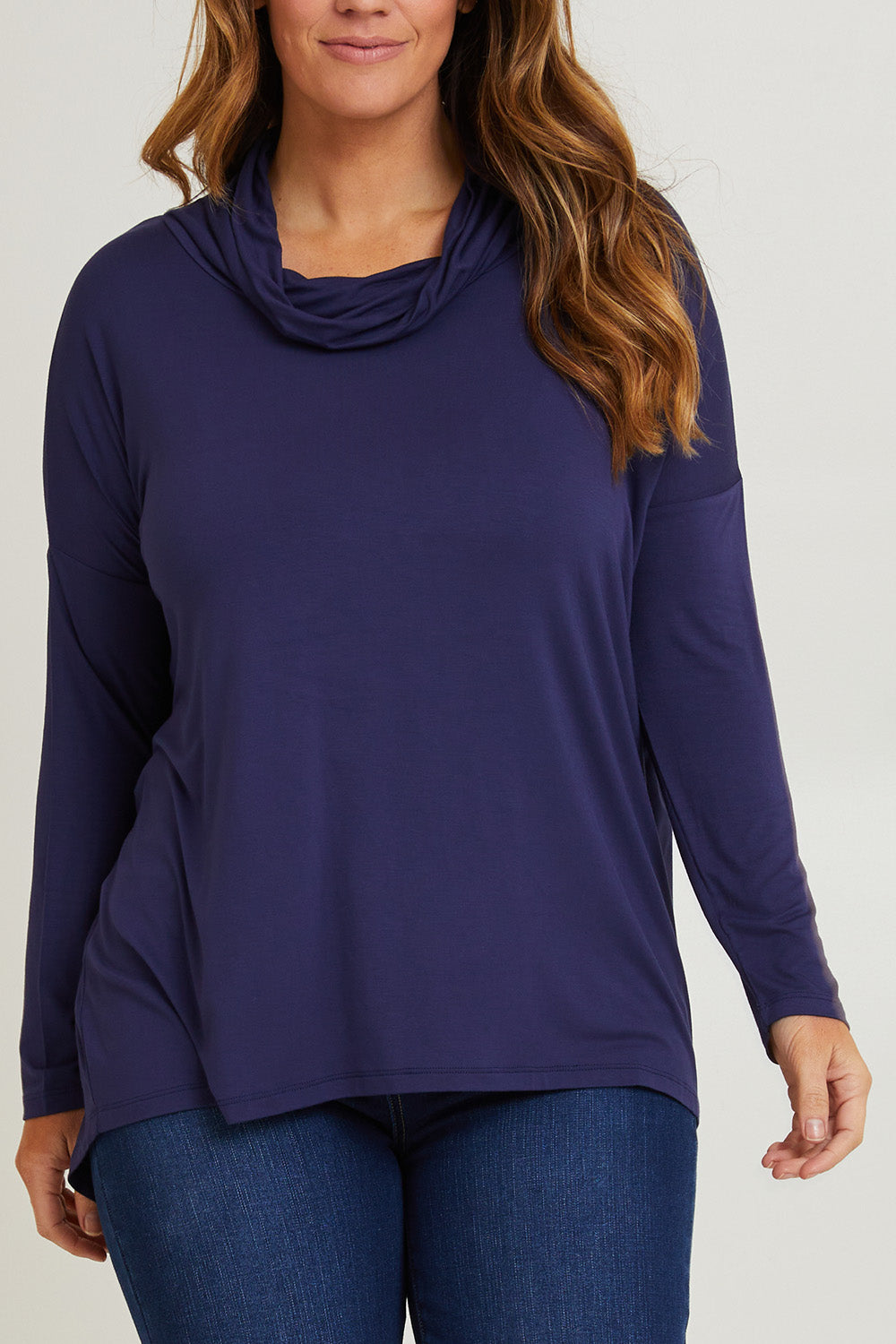 Model Laura wearing size 14 of the Cowl Bamboo Top in colour Navy (Blue), from the front, cropped image