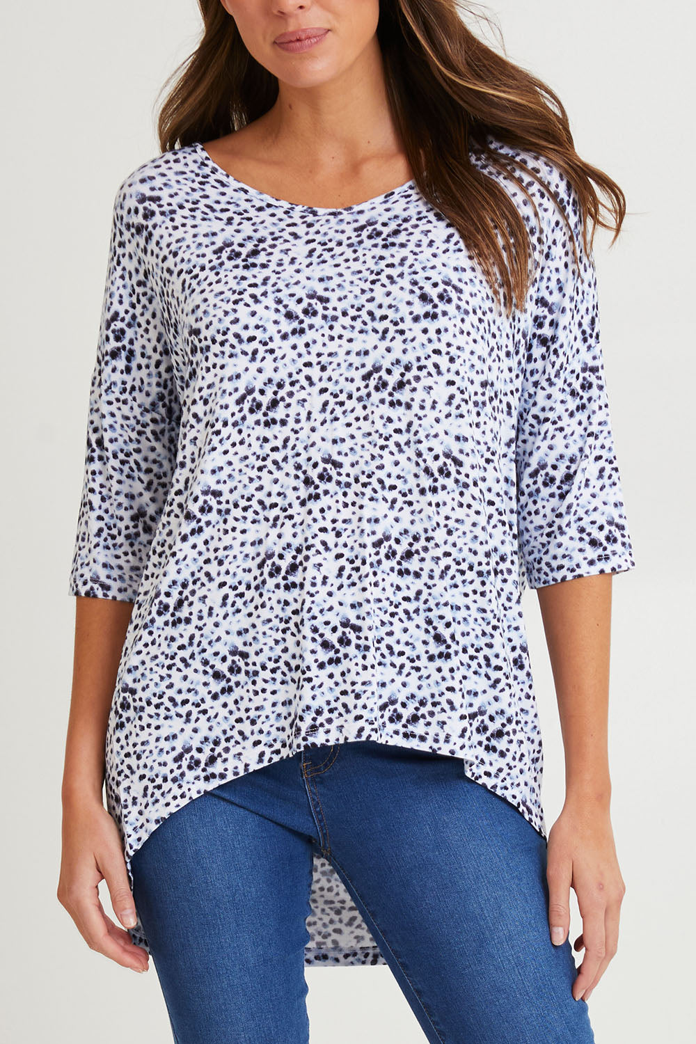 Model Madeline wearing size 10 of the Brielle Bamboo Vin colourNeck Tee - Snowleop (White), from the front, cropped image