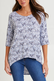 Model Madeline wearing size 10 of the Brielle Bamboo Vin colourNeck Tee - Snowleop (White), from the front, cropped image