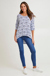 Model Madeline wearing size 10 of the Brielle Bamboo Vin colourNeck Tee - Snowleop (White), from the front, showing the whole outfit