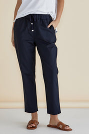 A model wearing the Kenzie Cotton Blend Jogger in colour Navy (Blue), from the front, cropped image