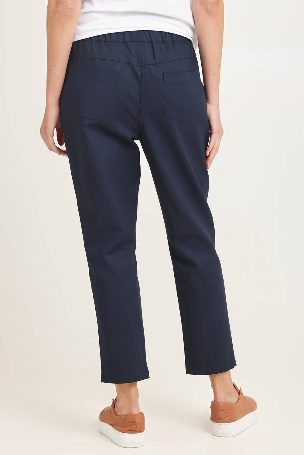 Model Madeline wearing size 10 of the Kenzie Cotton Blend Jogger in colour Navy (Blue), from the back