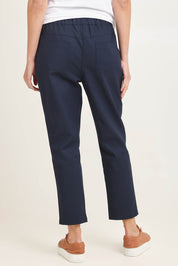 Model Madeline wearing size 10 of the Kenzie Cotton Blend Jogger in colour Navy (Blue), from the back