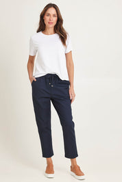 Model Madeline wearing size 10 of the Kenzie Cotton Blend Jogger in colour Navy (Blue), from the front, showing the whole outfit