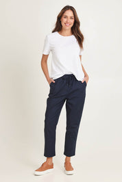 Model Madeline wearing size 10 of the Kenzie Cotton Blend Jogger in colour Navy (Blue), from the front, showing the whole outfit
