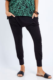 Model Lala wearing size 10 of the Barcelona Pant in colour Black (Black), from the front, cropped image