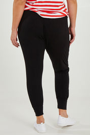 Model Maddy wearing size 16 of the Barcelona Pant in colour Black (Black), from the back