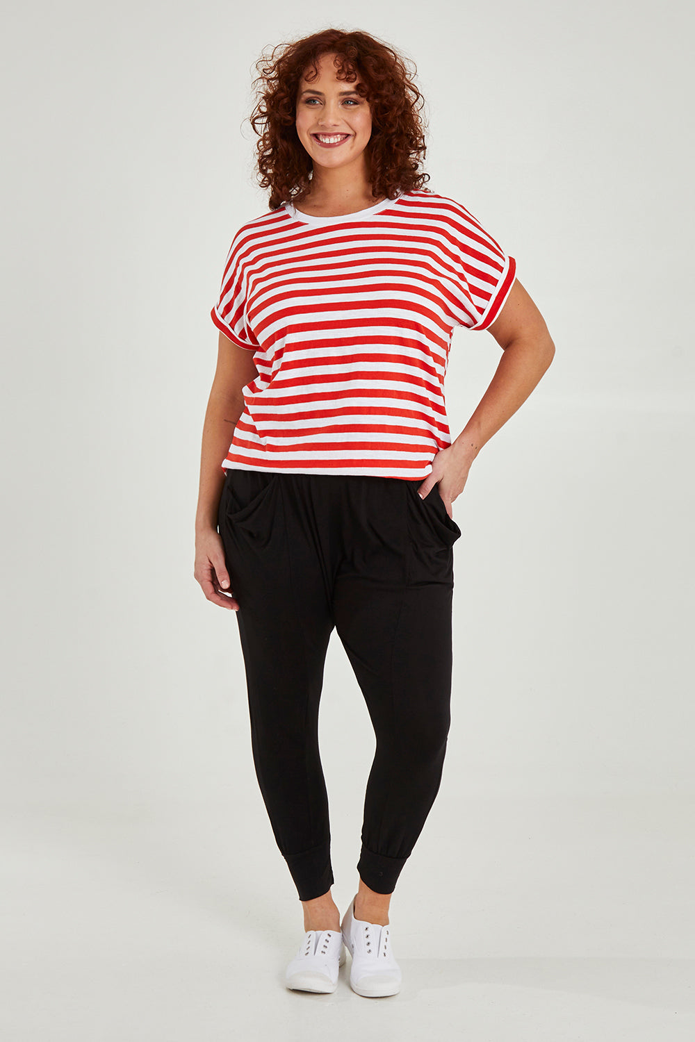 Model Maddy wearing size 16 of the Barcelona Pant in colour Black (Black), from the front, showing the whole outfit