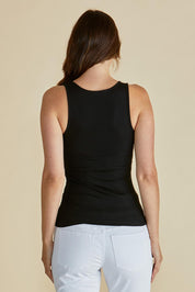 A model wearing the Tiana Cotton Blend Tank in colour Black (Black), from the back