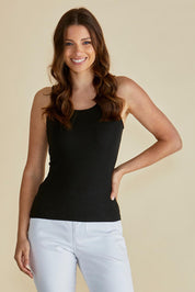 A model wearing the Tiana Cotton Blend Tank in colour Black (Black), from the front, cropped image