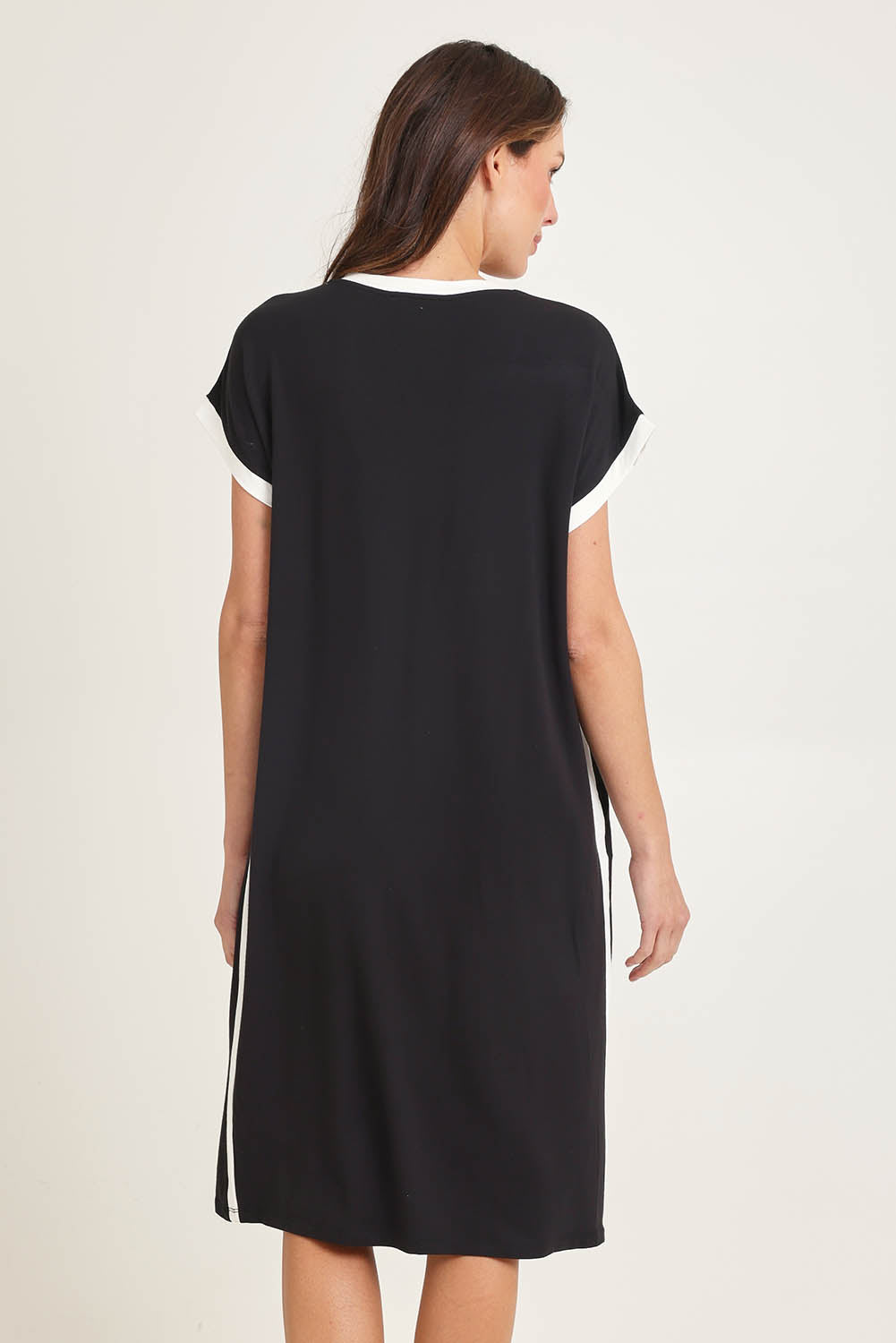 Model Madeline wearing size 10 of the Tula Tin colourShirt Dress - Black (Black), from the back